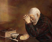 Man praying over his meal